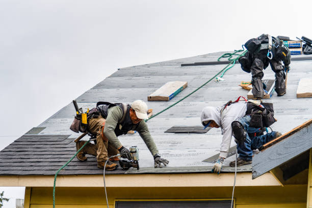 Professional Roofing technician working in Selden, NY